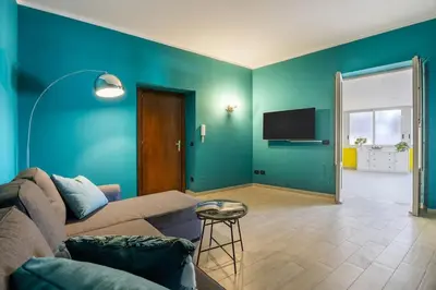 a living room with a couch and a flat screen tv at Vista San Domenico in Palermo