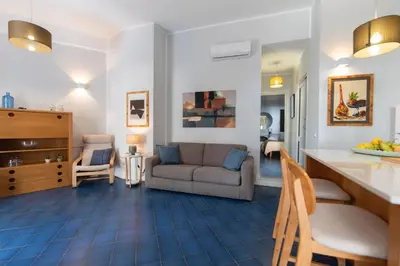 a living room with a couch and a table at Villa Makar Seaview in Macari