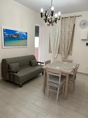 a living room with a couch and a table at La casa di Gabri in Palermo