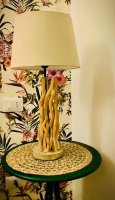 a table with a lamp on top of it at Le Case di Ciccine' in Bagheria