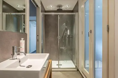 a bathroom with a sink and a shower at MetaM Apartment in the City Center by Wonderful Italy in Palermo