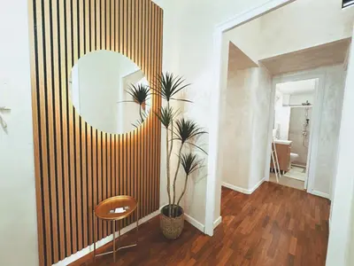 a room with a mirror and a potted plant at Casa Vacanze Imera House in Palermo