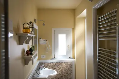 a bathroom with a sink and a window at Pane Amore e Marmellata in Palermo