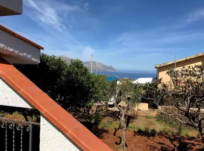 a view of the ocean from a balcony at La villa di Turi in Castellammare del Golfo