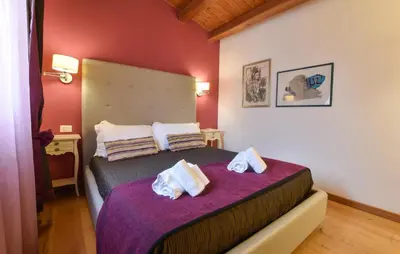 a bedroom with a bed with towels on it at Cozy Home In Partinico With Wifi in Partinico