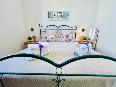 a bedroom with a large bed with pillows at Stella Marina in Carini