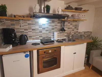a kitchen with a sink and a stove top oven at Sweet home Palermo in Palermo