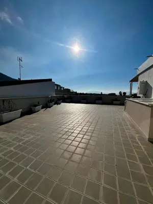 a view of a rooftop with the sun in the sky at Mari Sol in Terrasini