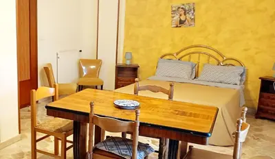a bedroom with a bed with two towels on it at Apartament di Nick Central Station No ZTL in Palermo