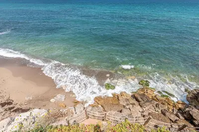 an aerial view of the beach and the ocean at Villetta Ficarazzi by Wonderful Italy in Ficarazzi