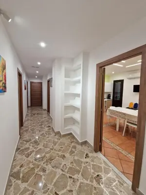 a hallway with a room with a bed at Casa Vera in Piana degli Albanesi
