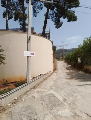 an empty street with a sign on a pole at Villa Buscemi in Bagheria