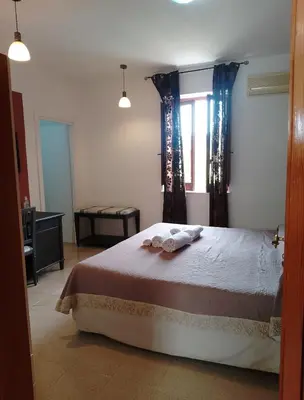 a bedroom with a bed with two towels on it at Villa Buscemi in Bagheria