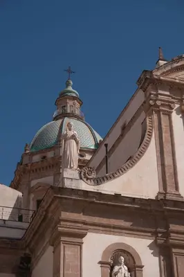 a building with a statue on top of it at Palazzo Giglio suite in Palermo