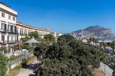 a view of a city with buildings and trees at Trinacria Luxury Suite in Palermo