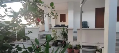 a room with potted plants on the floor at Villa Sole in Palermo