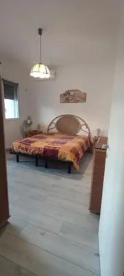 a bedroom with a large bed in a room at Villa Sole in Palermo