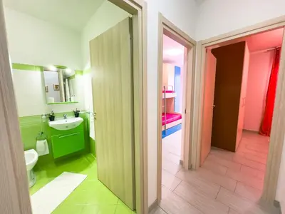 a bathroom with a toilet and a sink at Terrazza Bellini in Castellammare del Golfo