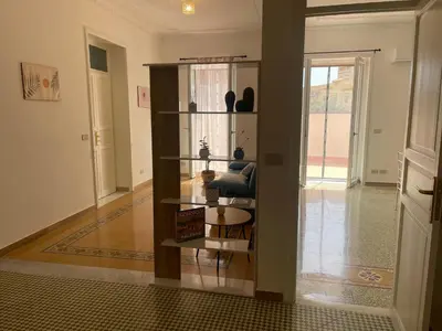 a living room with a book shelf in a room at Casa Marì Holiday House in Palermo