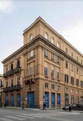 a large building on the corner of a street at Palazzo Monteleone Suite in Palermo