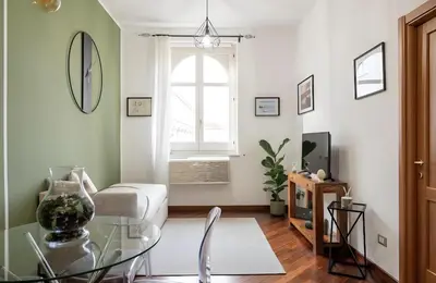 a living room with a glass table and a window at Palazzo Monteleone Suite in Palermo