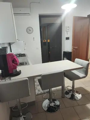 a kitchen with a table and two chairs at Casa Felice in Misilmeri