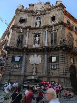 a group of people standing outside of a building at La dimora di Elma in Palermo