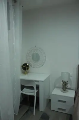 a white desk with a chair in a bedroom at Casa varco Santa Lucia in Palermo