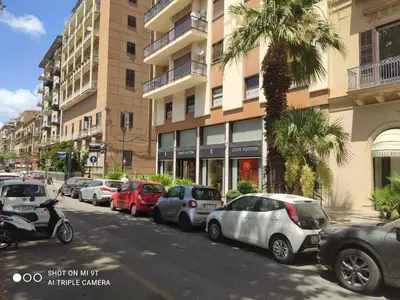 a row of cars parked on the side of a street at Casa varco Santa Lucia in Palermo