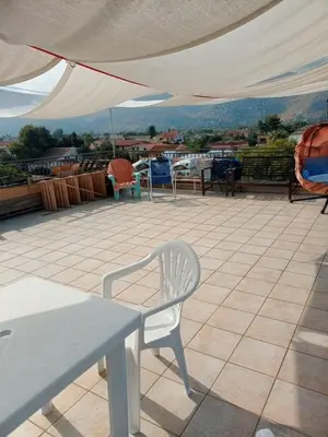 a white chair sitting on top of a roof at Terrazza Mare Mondello in Palermo