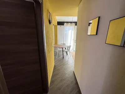 a door leading to a dining room with a table at Intero Appartamento con Terrazza - Villa Ciaculli in Palermo