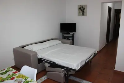 a hospital bed in a room with a tv at Casa Vacanze In Piazza in Terrasini