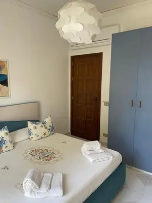 a bedroom with a bed with towels on it at Casa Vacanze Villa Lena in Santa Flavia