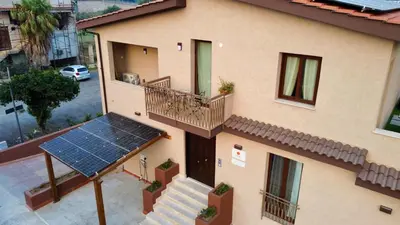 a house with a solar panel next to a building at Intero Appartamento con Solarium - Villa Ciaculli in Palermo