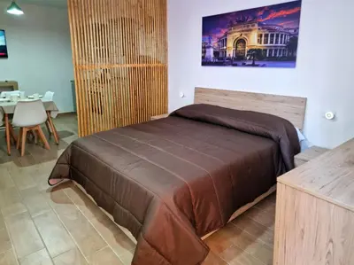 a bedroom with a large bed in a room at DIMORA SAITTA per SAITTA HOLIDAYS in Palermo