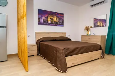 a bedroom with a bed in a room at DIMORA SAITTA per SAITTA HOLIDAYS in Palermo