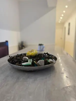 a plate of rocks sitting on top of a table at Mondello Telemaco Beach in Palermo