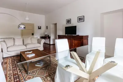 a living room with a couch and a table at Piazza Marina Suite By DomuSicily in Palermo