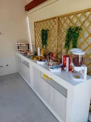 a kitchen with a counter with food on it at Olea in Castelluzzo