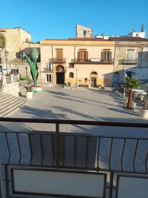 a view of a building from a balcony at La casa sulla piazza in Cerda