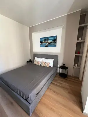 a bedroom with a large bed in a room at LaPignaVerde in Palermo