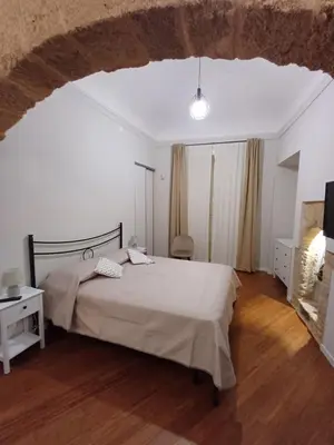 a bedroom with a large bed in a room at Residenza del Massimo in Palermo