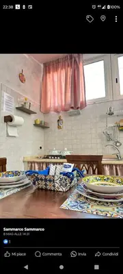 a kitchen with a counter with plates on it at Casa Patry in Palermo