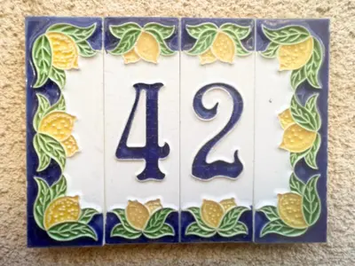a blue and white sign with a number fortytwo at I due archi in Bagheria