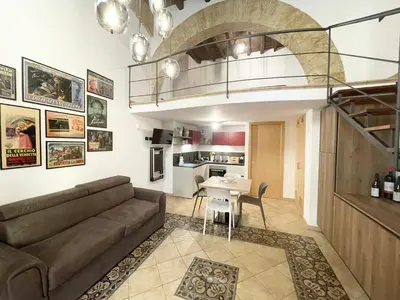 a living room with a couch and a table at I due archi in Bagheria