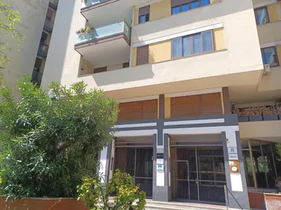 an apartment building with the front door open at LaPignaVerde Suites in Palermo