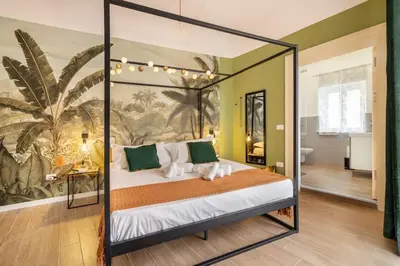 a bedroom with a canopy bed in a room at 145 Maqueda Palermo in Palermo