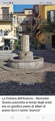 a picture of a fountain in the middle of a city at Teresita in Monreale