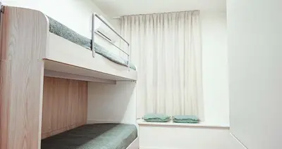 a bedroom with a bunk bed and a window at Villa Regina ai Faraglioni di Scopello in Scopello