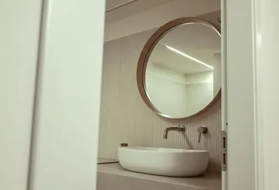 a bathroom with a sink and a mirror at Villa Regina ai Faraglioni di Scopello in Scopello